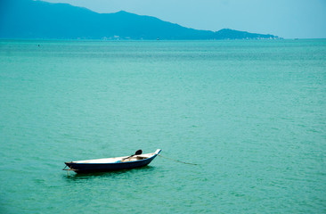 Floating boat in the sea