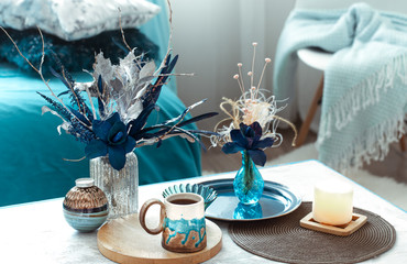 Still life vase with artificial flowers in the living room.