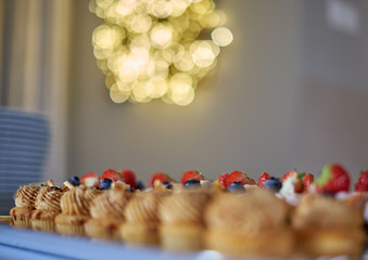 Celebration table full of cup cakes