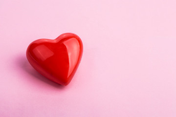 red heart on a pink background