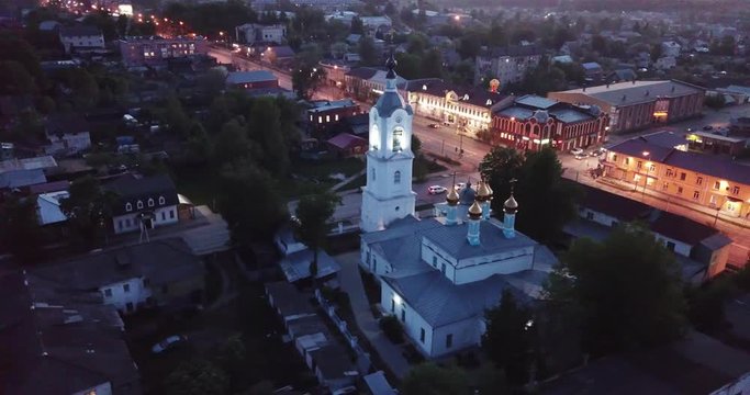 Night aerial view of Russian town of Pokrov with Cathedral of Intercession of Holy Virgin and busy M7 highway 
