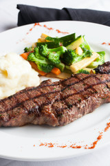 New York Strip Steak with Mashed Potatoes and Mixed Vegetables