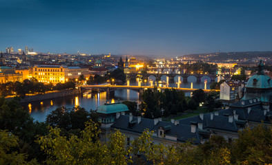 Fototapeta na wymiar Night view of Prague bridges over the river
