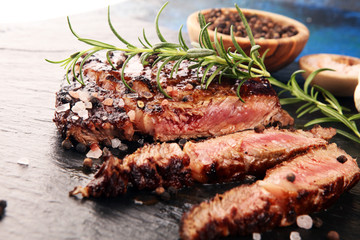 Barbecue Rib Eye Steak on Slate Slab - Dry Aged Wagyu Entrecote Steak and rosemary