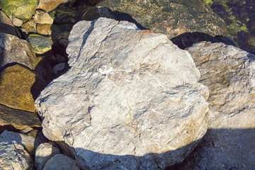 Stones on the Adriatic coast, background. Montenegro