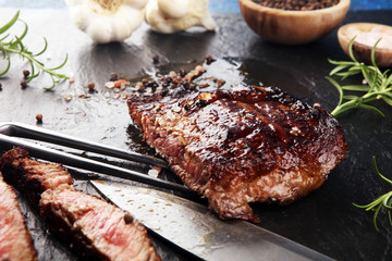 Barbecue Rib Eye Steak on Slate Slab - Dry Aged Wagyu Entrecote Steak and rosemary