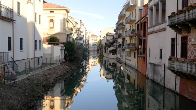 Padua 2019. Homes directly overlooking a city canal. We are on a cold but sunny winter day. December 2019 in Padua
