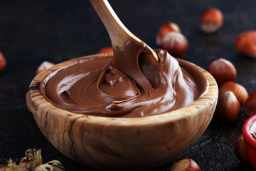 Homemade hazelnut spread in wooden bowl. Hazelnut Nougat cream with hazelnuts