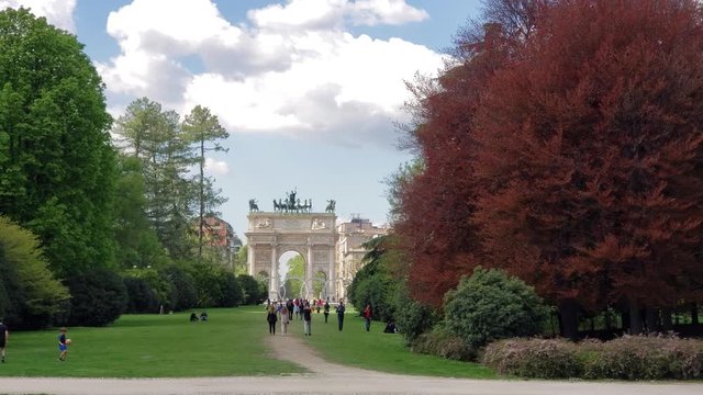Milan, Italy - April, 2019 - Wide shot in of Simplon Square (Piazza Sempione) including Simplon Gate (Porta Sempione).