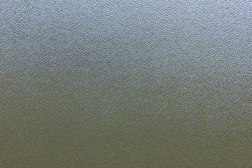 Texture of a frosted glass window with soft sunlight shining through it