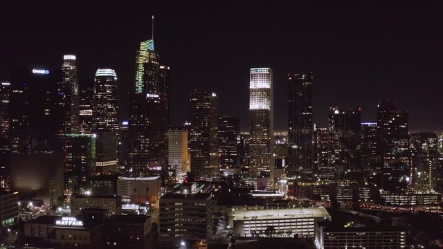 Reversed aerial view of City of Los Angeles downtown at night in California 