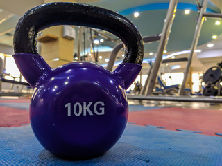 Naklejka na ściany i meble Body weights and dumbbells for arms, legs and bodybuilding biceps, triceps and chest, back. Modern gym for training every day.