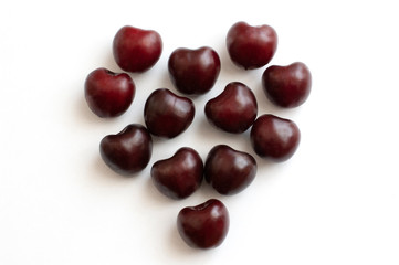 Cherries heart shaped on whie background. Love concept. Romantic concept.