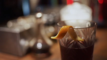 Alcohol cocktail with orange peel