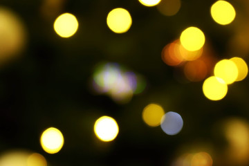 Obraz premium Long exposure blurred yellow and blue christmas tree lights abstract background