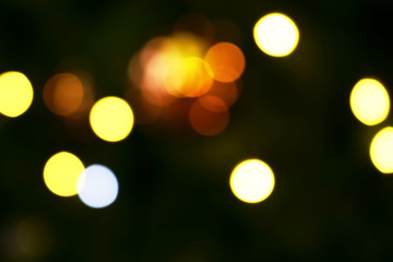 Long exposure blurred yellow and white christmas tree lights abstract background