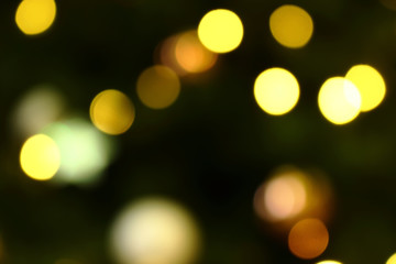 Long exposure blurred yellow and white christmas tree lights abstract background