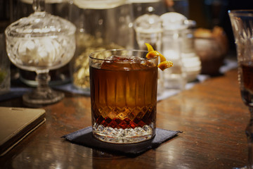 Alcohol cocktail with orange peel