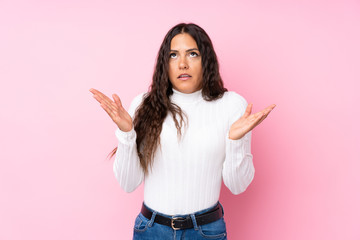 Young woman over isolated pink background frustrated by a bad situation