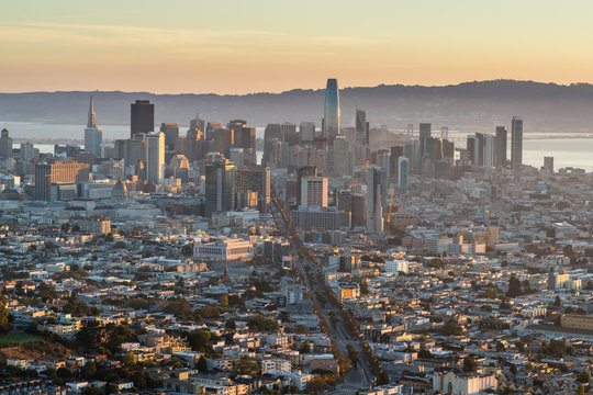 View of San Francisco Skyscrappers In the Early Sunrise Light With Fog over the Bay