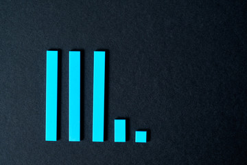 Bar graph on a black background. Color blocks. crisis and recession concept