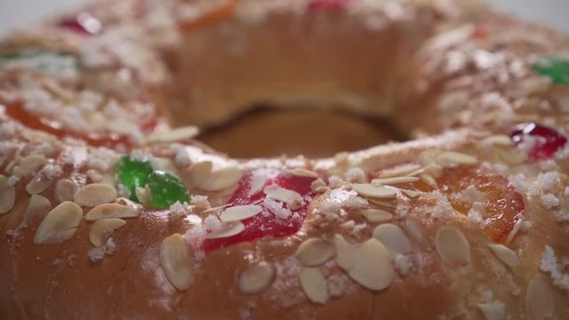 Traditional spanish round cake ROSCON KINGS with fruit and nuts. Smooth lighting and play of light