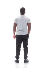 rear view. young man looking at white blank screen.