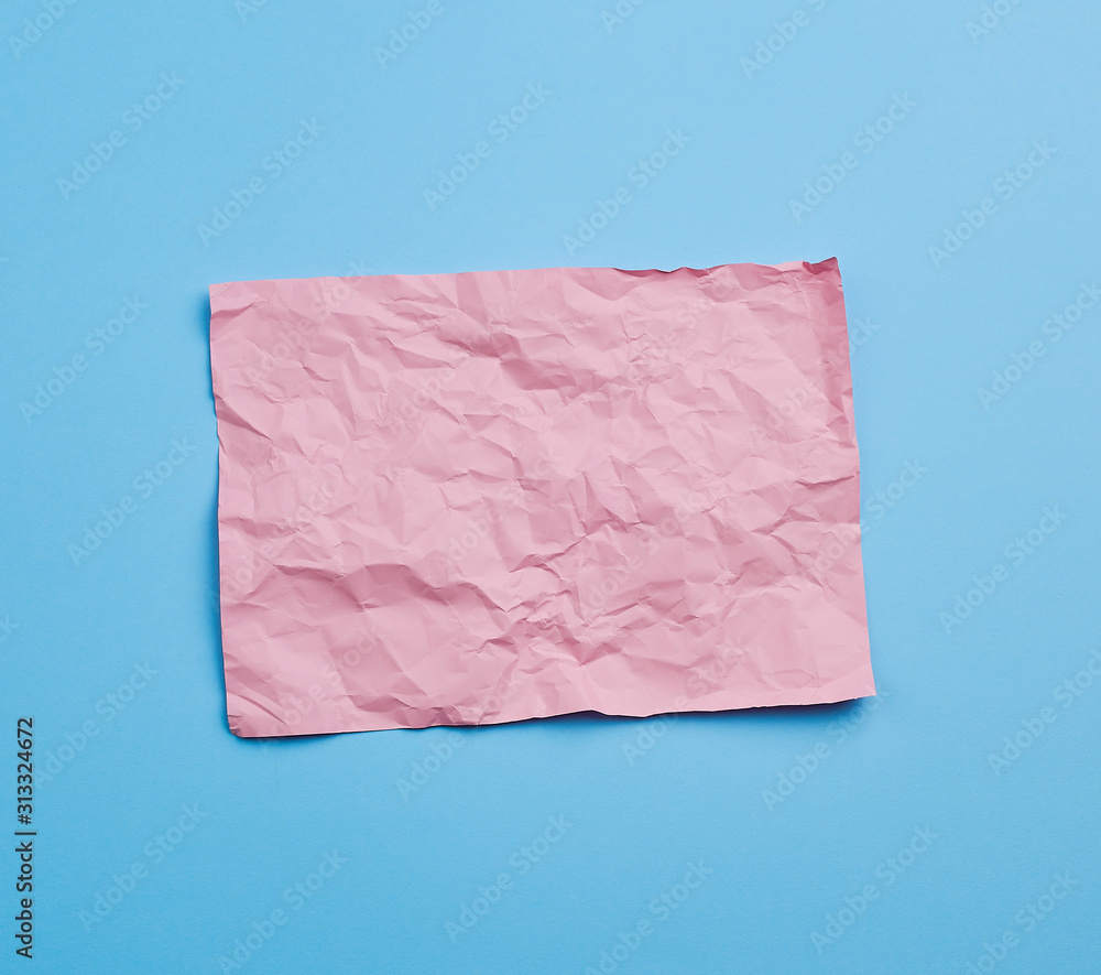 Poster empty crumpled pink rectangular sheet of paper a4 on a blue background