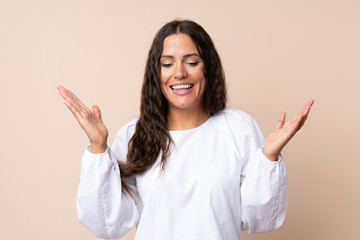 Young woman over isolated background laughing