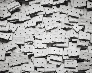 Aerial Perspective on a Layered Field of Unlabelled White Plastic Music Cassettes