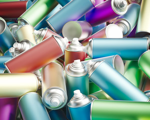 Lightly Colored Metal Spray Cans in a Messy Pile