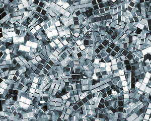 Aerial Perspective of Shiny Metal Tetrominoes In a Chaotic Pile