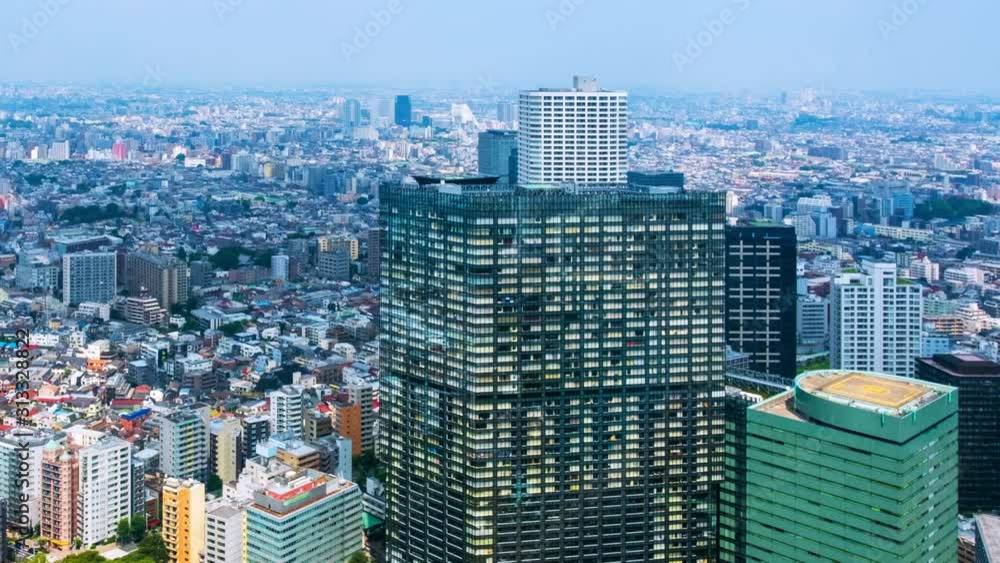 Sticker Tokyo, Japan. Aerial view of modern skyscrapers during the sunny day in Shinjuku, Tokyo, Japan. Time-lapse of car traffic on the road, panning video