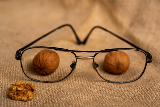 Vision. Walnuts kernels. Food for eyes health. Foods that contain vitamins, nutrients, minerals and antioxidants. Poor night vision, cataracts and glaucoma prevention. Walnuts kernels in glasses.