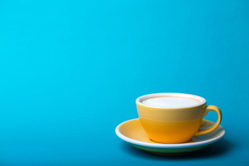 yellow cup on a blue background