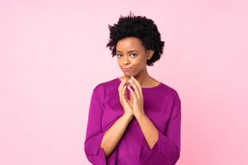 African american woman over isolated pink background scheming something