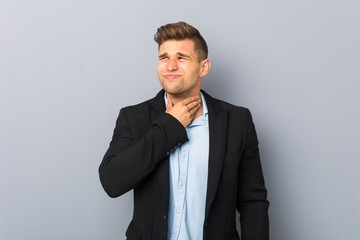 Young handsome caucasian man suffers pain in throat due a virus or infection.