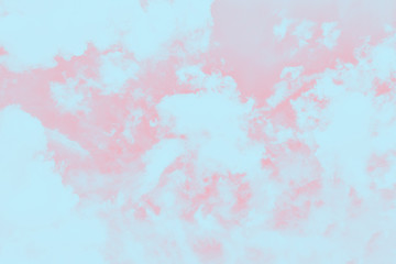 Beautiful pink coral sky with fluffy white clouds
