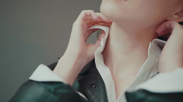 Attractive fashin girl corrects the collar, fashion clothes