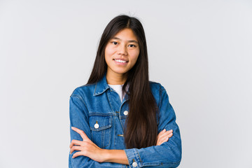 Young asian woman who feels confident, crossing arms with determination.