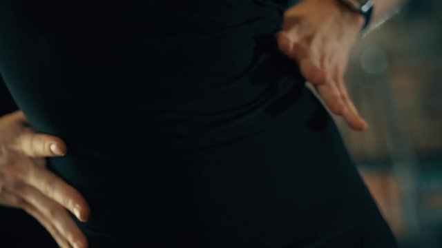 close-up of the legs of a man and a woman dancing a pair of ballroom dance in the room. Dance moves of the tango, Latinos, the Paso Doble. Gait.