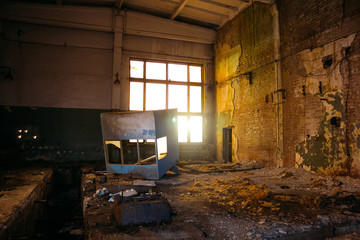 Fototapeta na wymiar Dark dirty abandoned ruined industrial building at night
