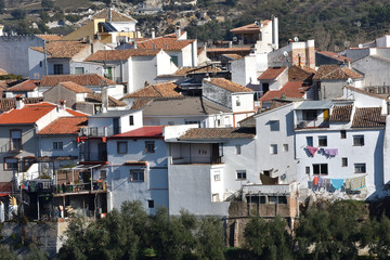 Obraz premium White houses of an Andalusian mountain village with details of everyday life
