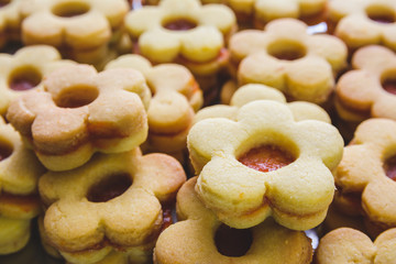 Flower shaped homemade cookies filled with jam
