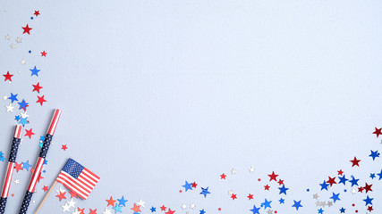Obraz premium Happy Presidents Day banner with American flag, drinking straws and confetti on blue background. USA Independence Day, American Labor day, Memorial Day, US election concept.