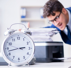 Businessman making copies in copying machine