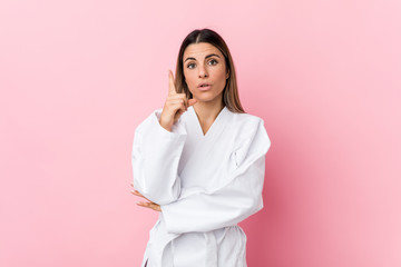 Young karate woman having some great idea, concept of creativity.