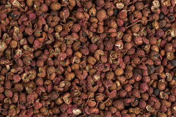 sichuan pepper background. Natural seasoning texture. Food ingredient.