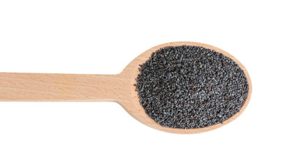 blue poppy seeds in wooden spoon isolated on white background. food ingredient.
