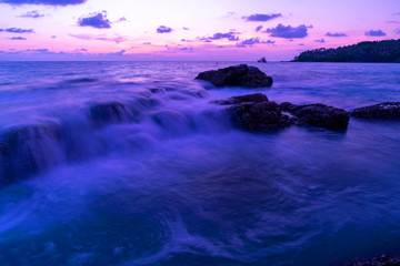 Long exposure image of Dramatic sky seascape sunrise or sunset scenery view Beautiful light nature and crashing wave on rocks.